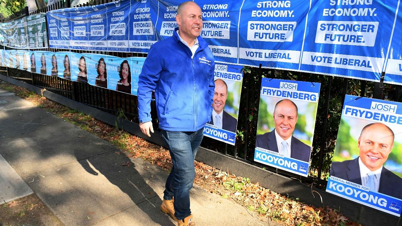 Australia's Treasurer Josh Frydenberg leaves a polling booth after voting during Australia's federal election in Melbourne. Credit: AFP Photo