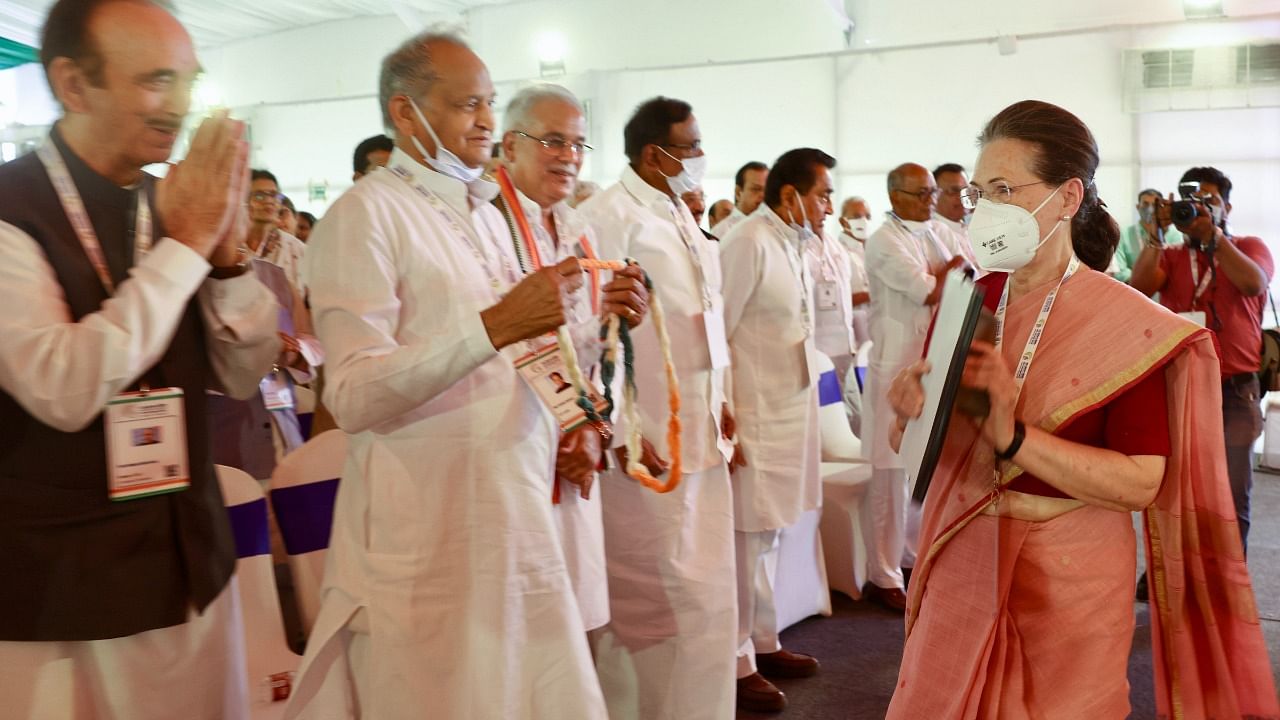 Congress interim President Sonia Gandhi greets Rajasthan Chief Minister Ashok Gehlot and senior Congress leader Ghulam Nabi Azad during the party's 'Nav Sankalp Chintan Shivir', in Udaipur. Credit: PTI File Photo