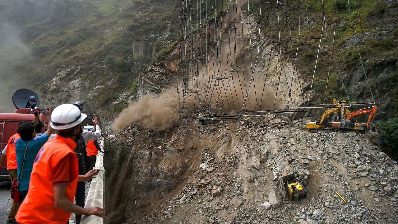 Rescue operation halted due to a landslide, after a portion of an under-construction tunnel on the Jammu-Srinagar national highway collapsed near Magarkote in Ramban district. Credit: PTI Photo