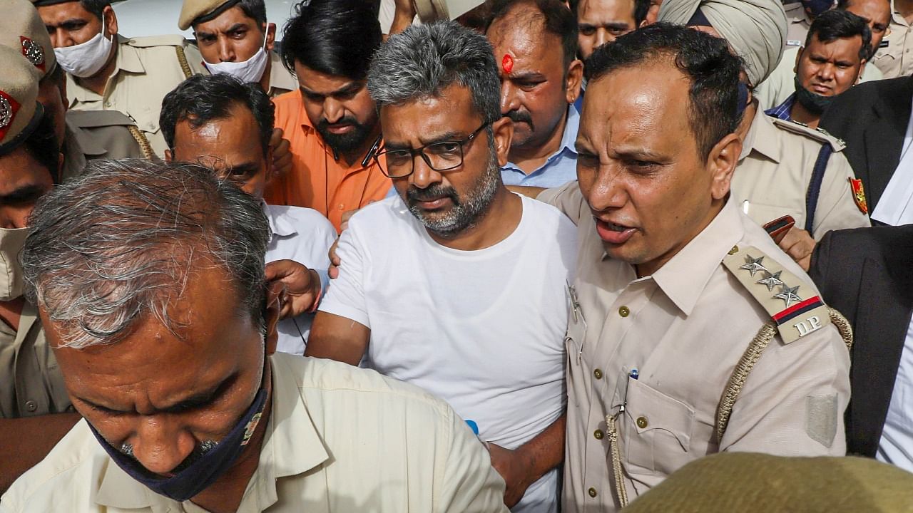Delhi University Professor Ratan Lal, who was earlier arrested by Delhi Police for his social media post related to Gyanvapi Mosque case, being produced at Tis Hazari Court in New Delhi. Credit: PTI Photo