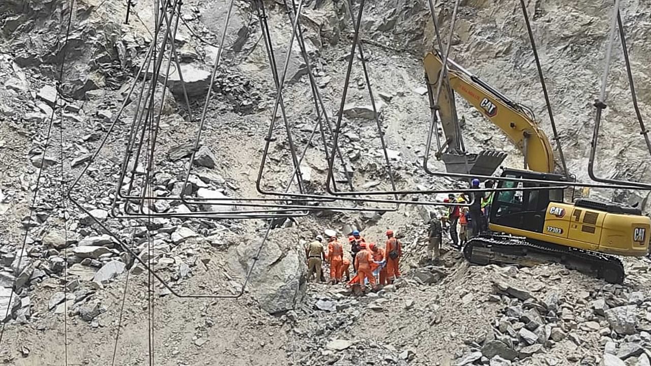 Rescue operation underway on the second consecutive day to save labourers trapped under debris following the collapse of an under-construction tunnel on the Jammu-Srinagar national highway. Credit: PTI Photo