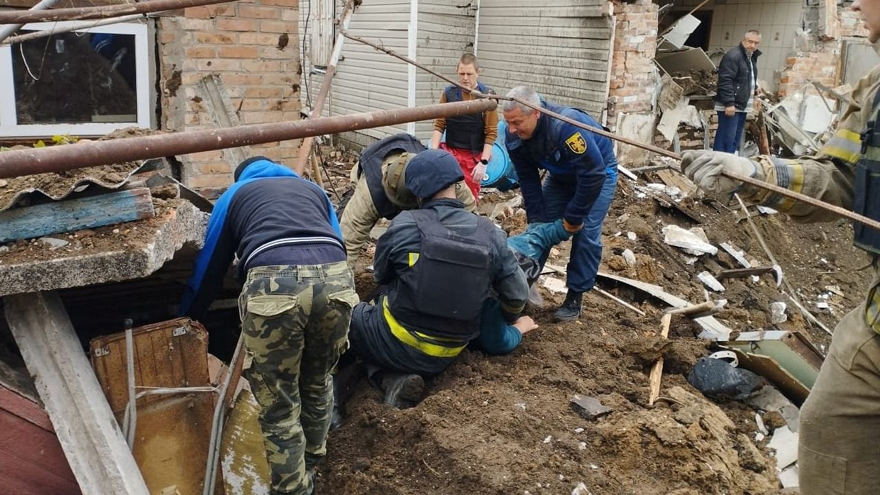 Police officers help rescue people from the rubble after an air strike in Bakhmut, Donetsk Region. Credit: Reuters Photo