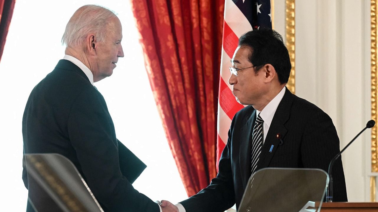 US President Joe Biden shakes hands with Japanese Prime Minister Fumio Kishida. Credit: AFP Photo