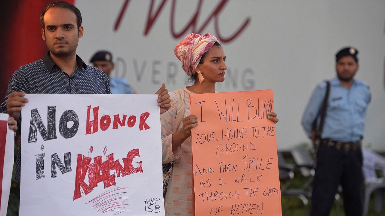Activists display placards during a protest in Islamabad against the murder of social media star Qandeel Baloch by her brother. Credit: AFP Photo