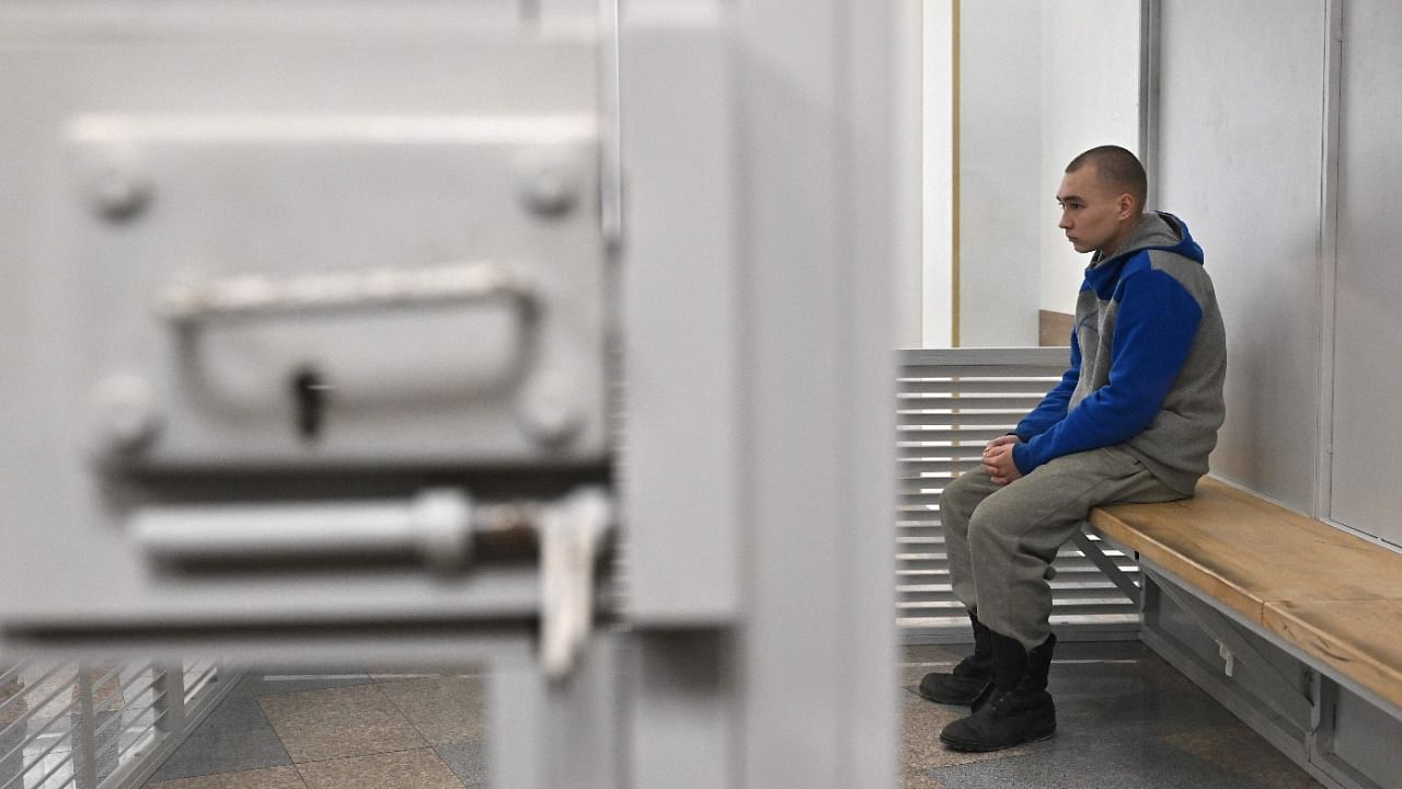  A Kyiv court ruled that a 21-year-old Russian soldier who killed a civilian was guilty of war crimes and handed him a life sentence, in the first verdict against Moscow's forces since their invasion. Credit: AFP Photo