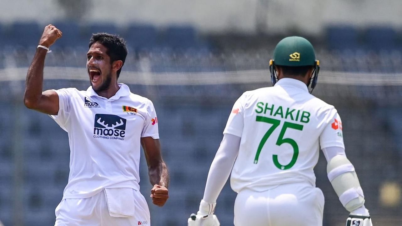 Sri Lanka's Kasun Rajitha (L) celebrates after dismissing Bangladesh's Shakib Al Hasan (R) during the first day of the second Test cricket match between Bangladesh and Sri Lanka at the Sher-e-Bangla National Cricket Stadium in Dhaka. Credit: AFP Photo