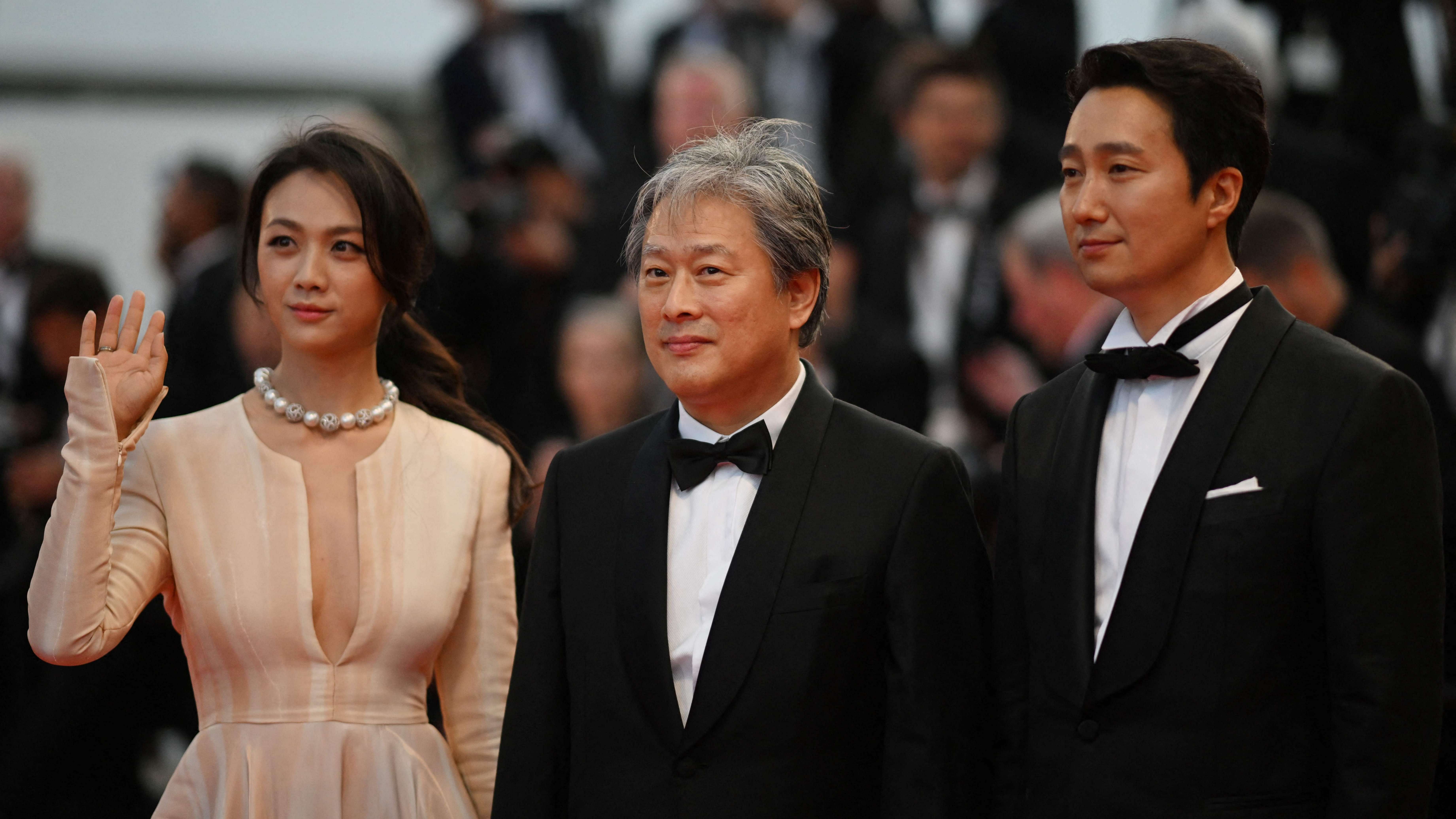 Chinese actress Tang Wei, South Korean producer Park Chan-Wook and South Korean actor Park Hae-Il arrive for the screening of the film "Decision to Leave (Heojil Kyolshim)" during the 75th edition of the Cannes Film Festival. Credit: AFP Photo