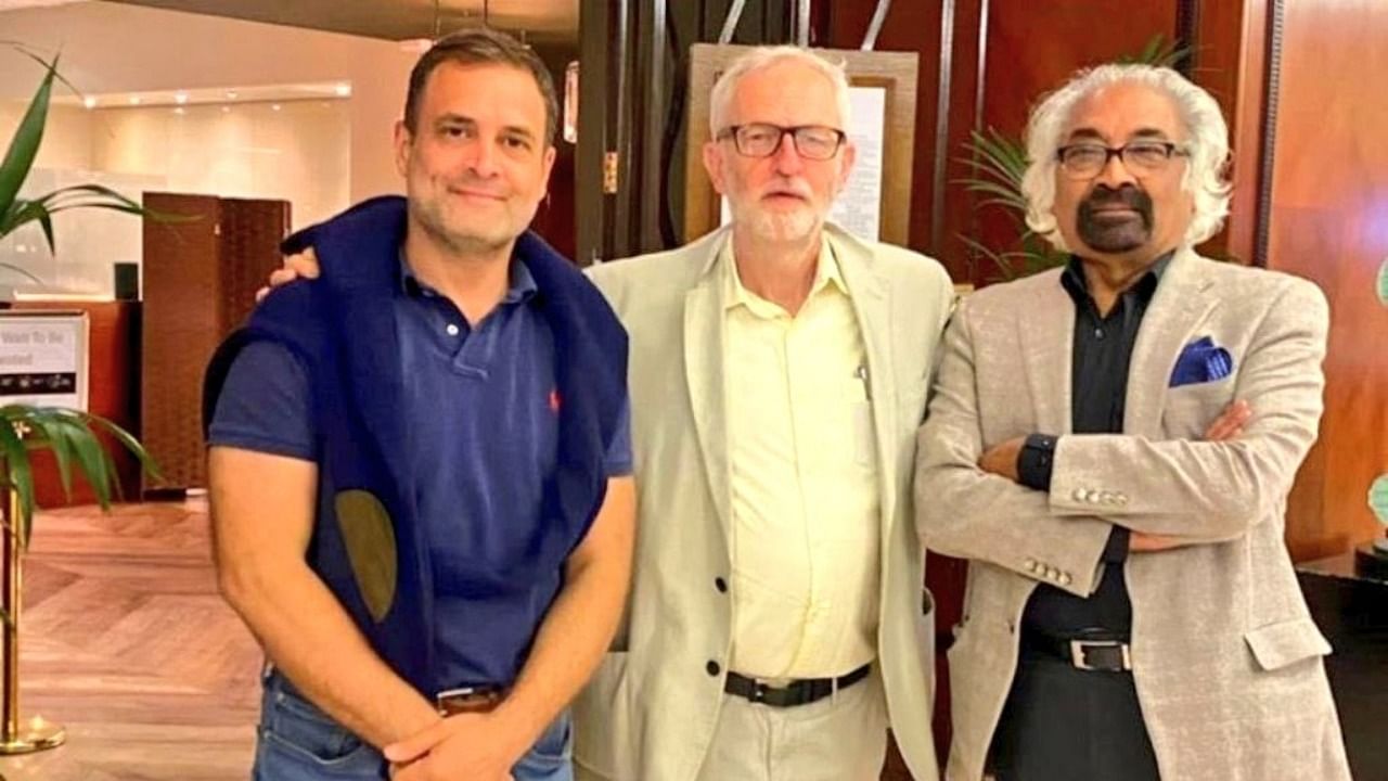 Rahul Gandhi with Jeremy Corbyn (centre) and Sam Pitroda (right). Credit: Twitter/@KirenRijiju