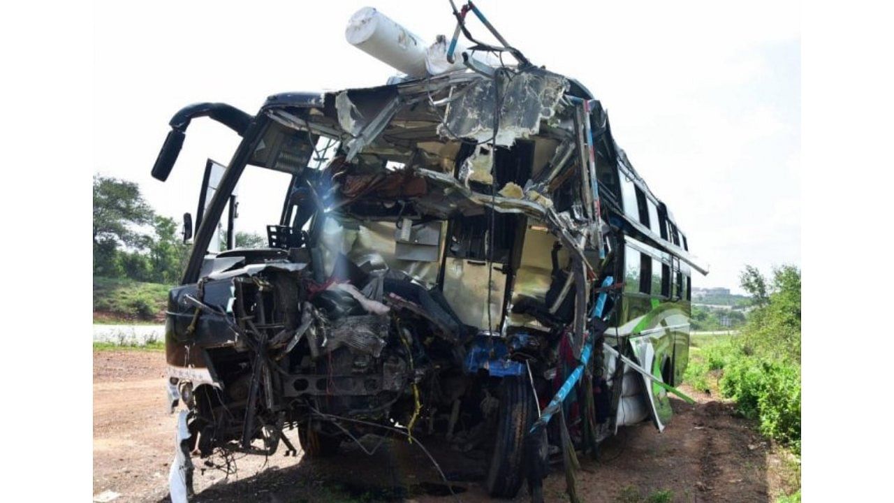 Mangled remains of the bus which collided with a lorry on Hubballi-Dharwad bypass road. Credit: DH Photo