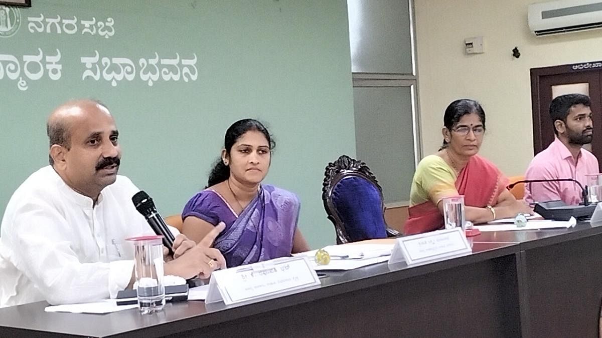 MLA Raghupathi Bhat speaks at a CMC meeting in Udupi on Wednesday.