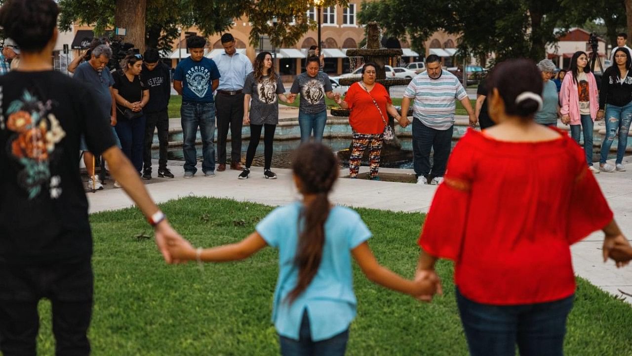 Members of the community gather at the City of Uvalde Town Square for a prayer vigil in the wake of a mass shooting at Robb Elementary School. Credit: AFP Photo