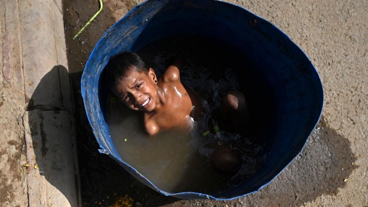 Extreme heat in India pushed up electricity use to unprecedented highs with people cranking up their air-conditioning, causing widespread power cuts since April as utilities scrambled to meet demand amid dwindling coal supplies. Credit: AFP File Photo