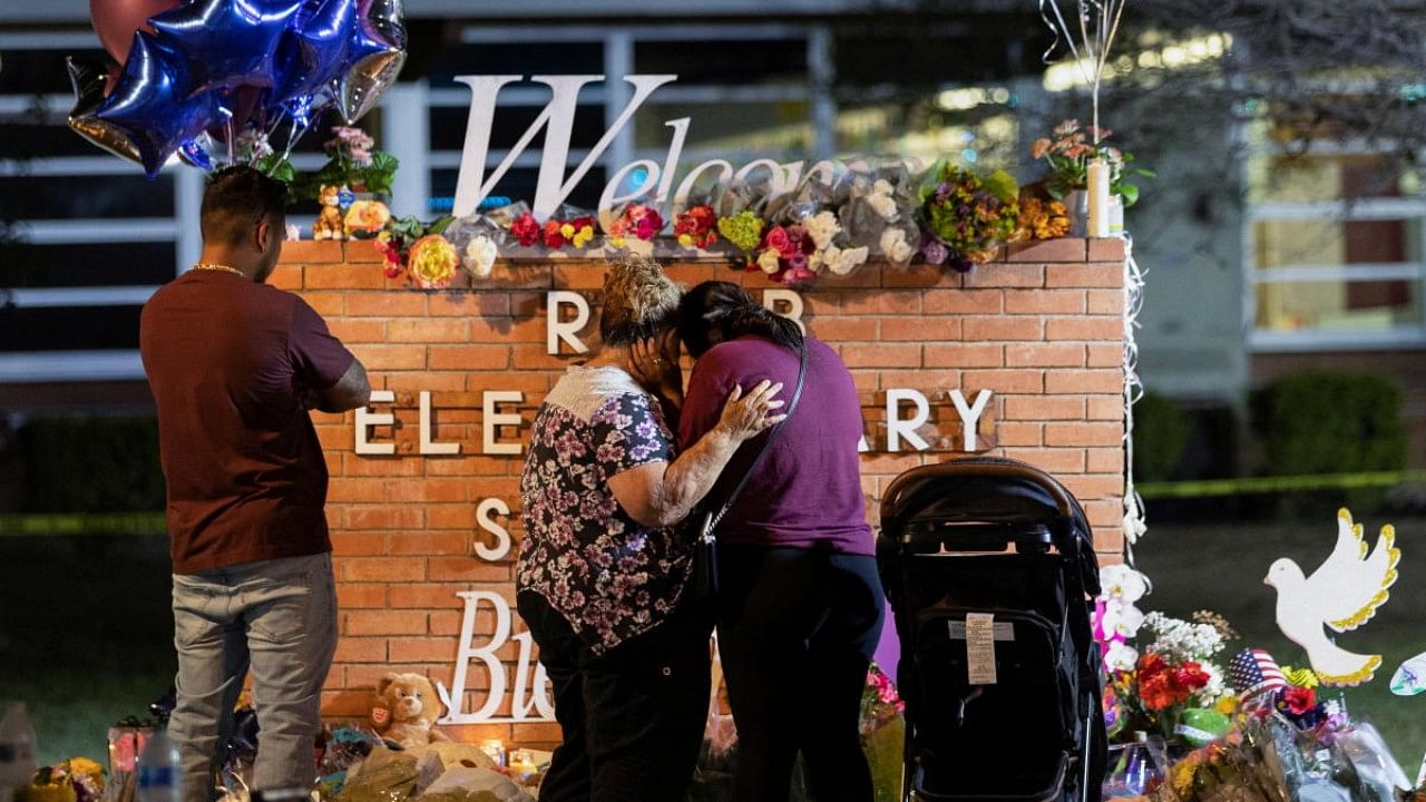 People react after a mass shooting at Robb Elementary School in Uvalde. Credit: Reuters Photo