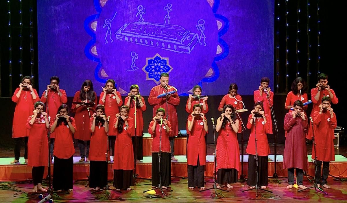 Saitejas Chandrashekar (top row, sixth from left) with students of Hamsanada. Now a foundation for the harmonica, Hamsanada began as an informal group.