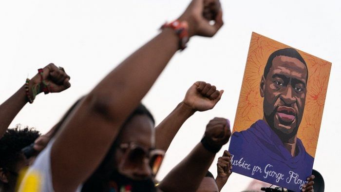 The date of the signing is highly symbolic, coming exactly two years after Floyd's death, which triggered huge nationwide demonstrations against racism and police brutality. Credit: AFP Photo