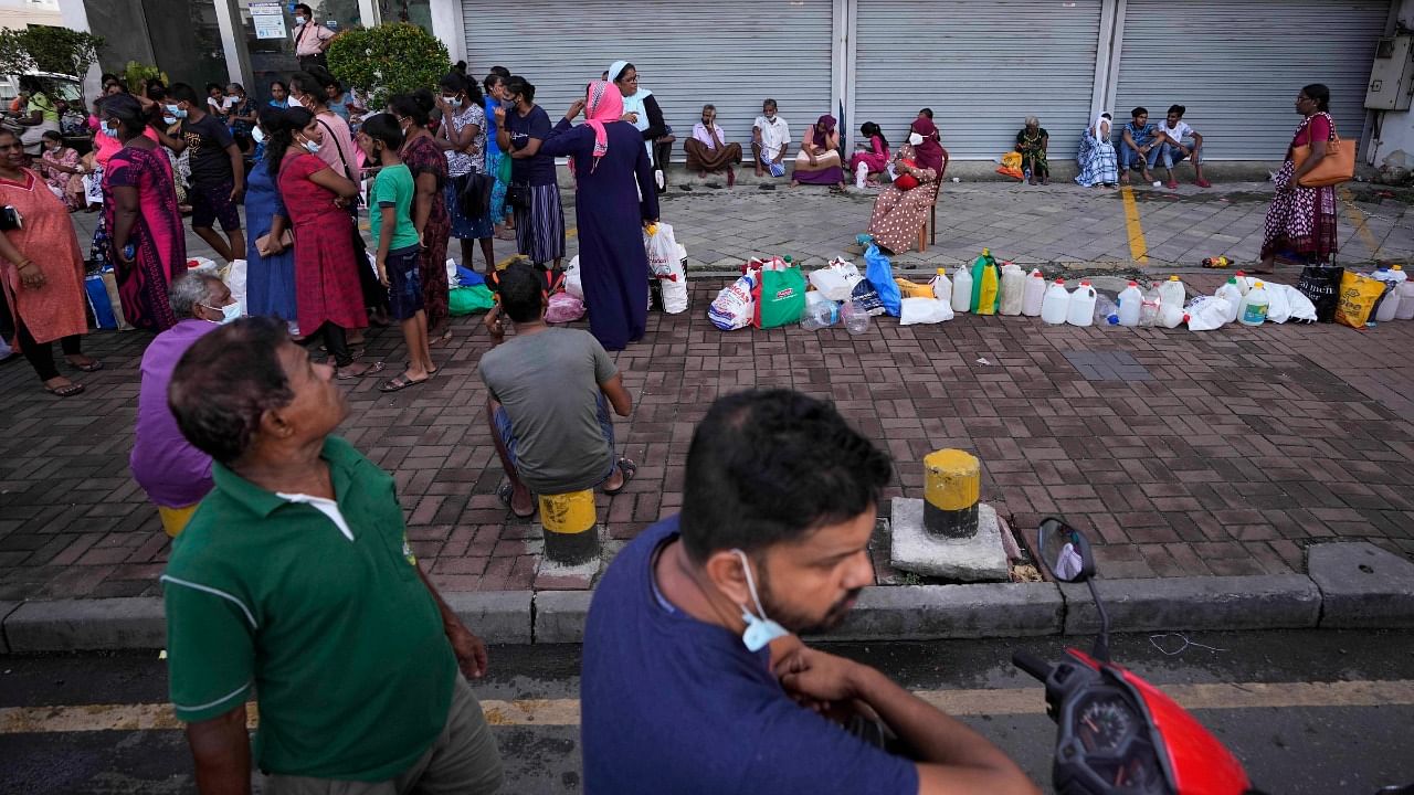 Sri Lankans stand in queues to buy fuel in Colombo, Sri Lanka. Credit: AP Photo