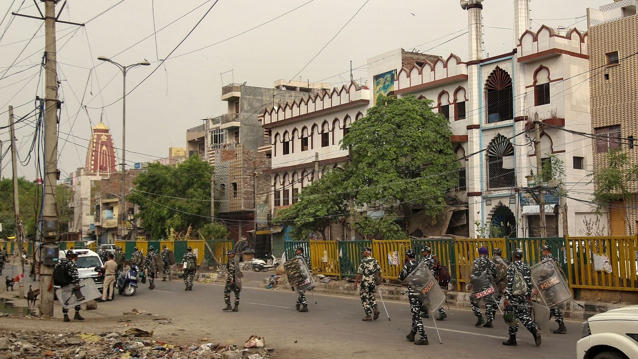 aramilitary Force personnel patrol during Eid-al-Fitr, at Jahangirpuri. Credit: PTI Photo