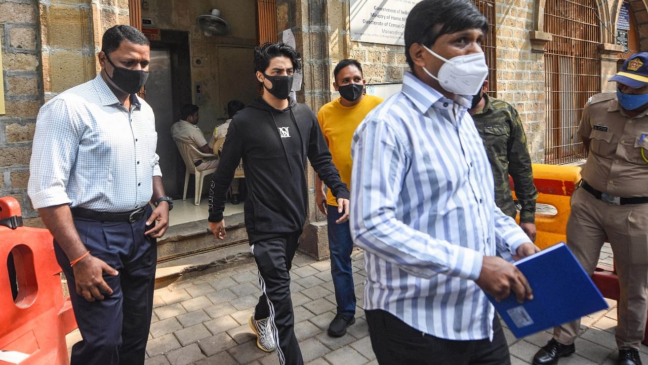 Aryan Khan, son of Bollywood actor Shahrukh Khan, leaves the NCB office after marking his attendance as part of bail conditions in a drugs case in Mumbai. Credit: PTI Photo