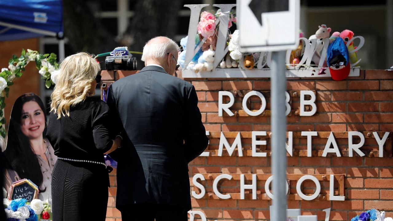 US President Joe Biden and first lady Jill Biden pay their respects at the Robb Elementary School memorial, where a gunman killed 19 children and two teachers in the deadliest US school shooting in nearly a decade, in Uvalde, Texas. Credit: Reuters photo