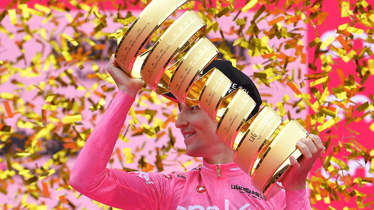 Jai Hindley celebrates with the trophy after winning Giro d'Italia. Credit: Reuters Photo