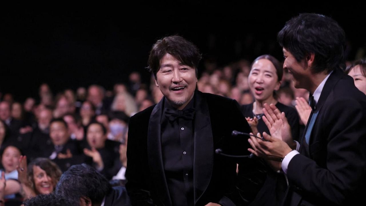 South Korean actor Song Kang-Ho reacts after he was awarded with the Best Actor Prize for his part in "Broker" during the 75th edition of the Cannes Film Festival. Credit: Reuters photo