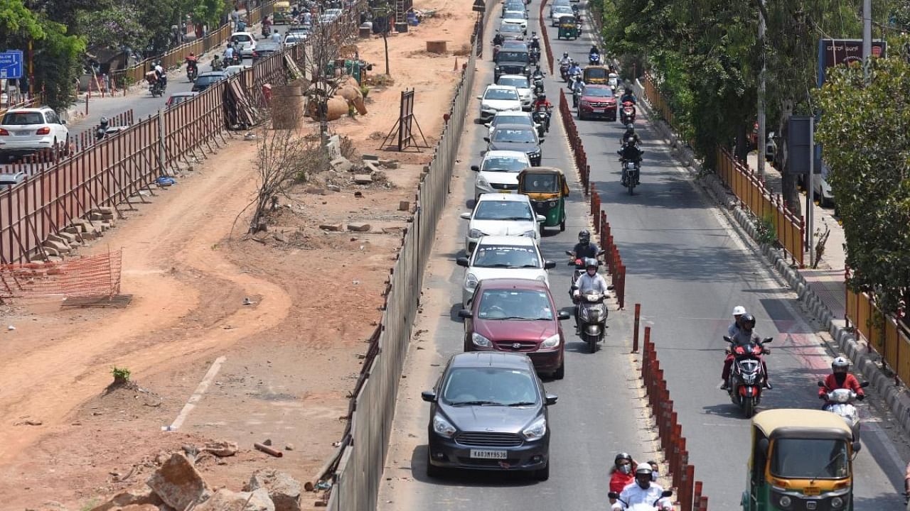 Commuters occupy bus lane on Marathahalli Outer Ring Road where BMRCL work is going on, in Bengaluru. Credit: DH file photo