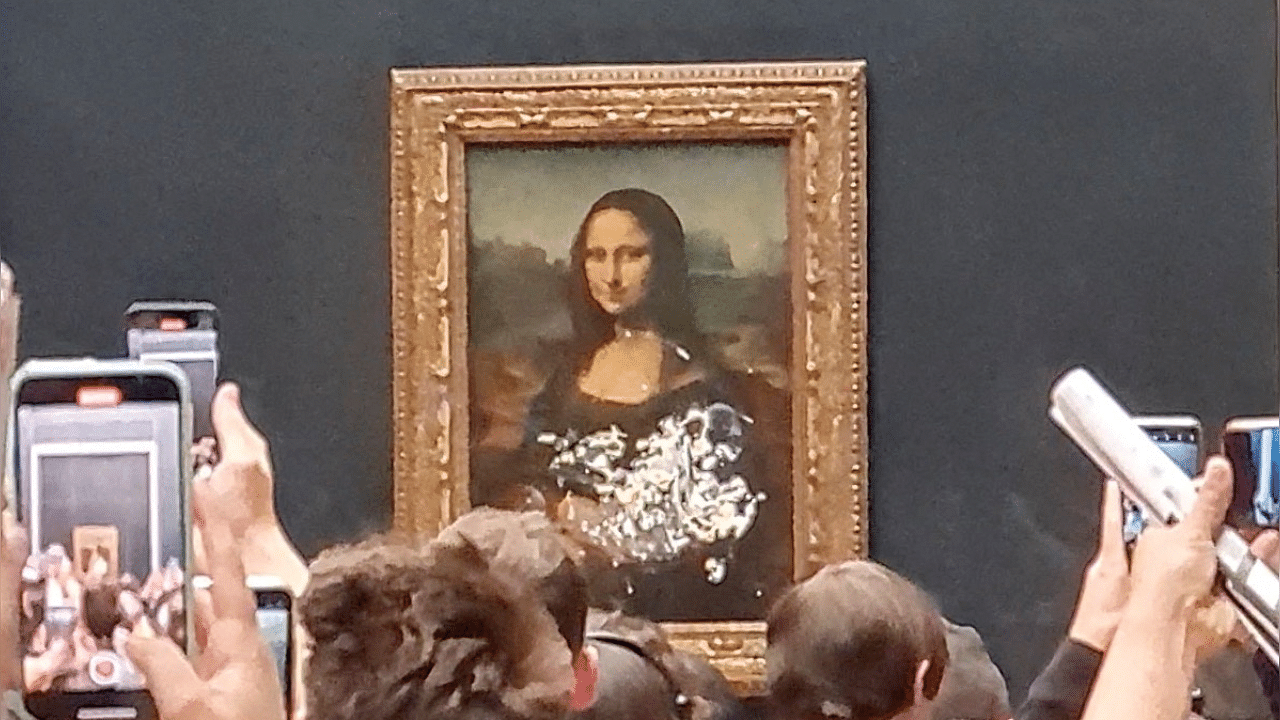 The Mona Lisa has been behind glass since a Bolivian man threw a rock at the painting in December 1956. Credit: Reuters Photo