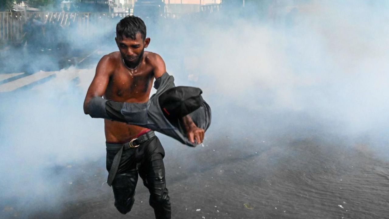 Police use tear gas shells to disperse students taking part in an anti-government protest demanding the resignation of Sri Lanka's President Gotabaya Rajapaksa over the country's crippling economic crisis. Credit: AFP Photo