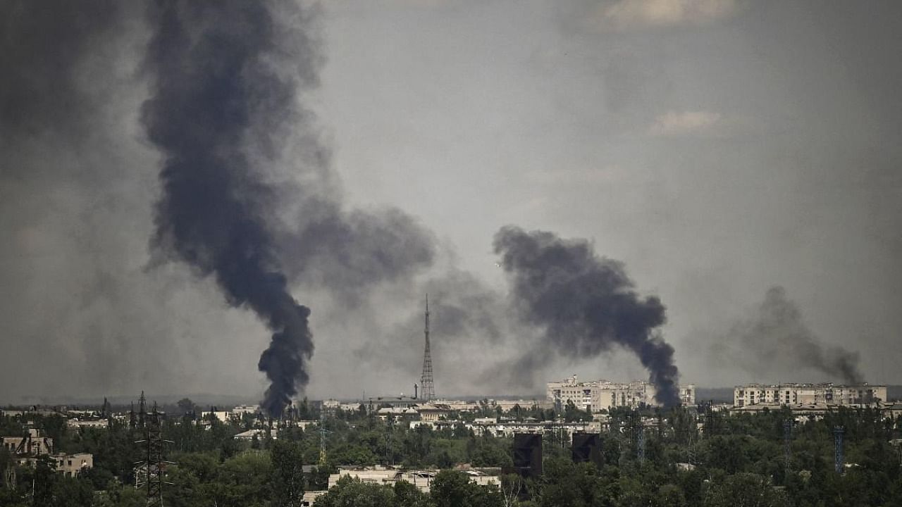 Smoke rises in the city of Severodonetsk during heavy fightings between Ukrainian and Russian troops at eastern Ukrainian region of Donbas on May 30, 2022, on the 96th day of the Russian invasion of Ukraine. Credit: AFP Photo