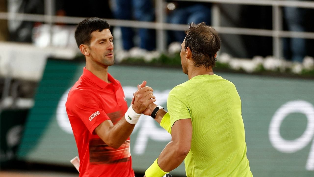 Spain's Rafael Nadal shakes hands with Serbia's Novak Djokovic after winning their quarter final match. Credit: Reuters photo