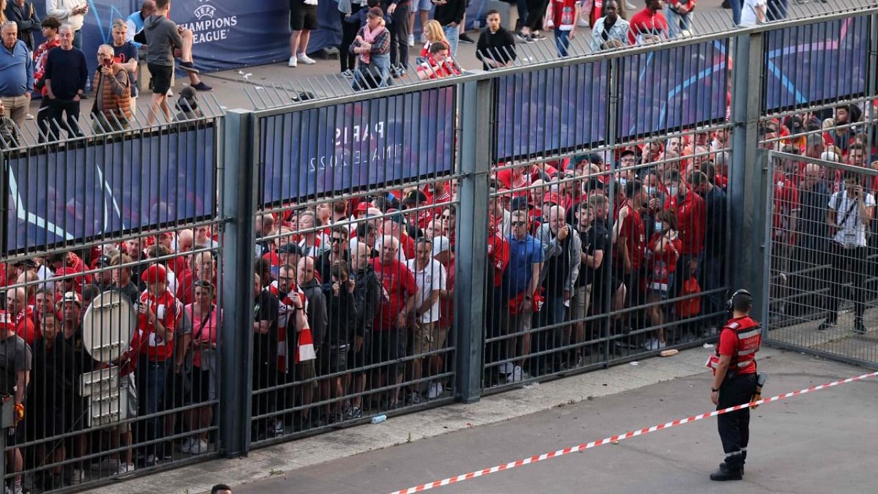 Liverpool fans stand outside prior to the UEFA Champions League final football match between Liverpool and Real Madrid at the Stade de France in Saint-Denis. Credit: AFP file photo