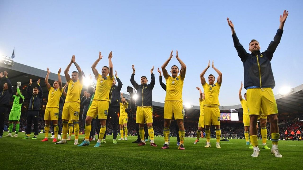 Ukraine's players applaud their fains after winning the FIFA World Cup 2022 play-off semi-final qualifier football match between Scotland and Ukraine at Hampden Park in Glasgow, Scotland. Credit: AFP Photo