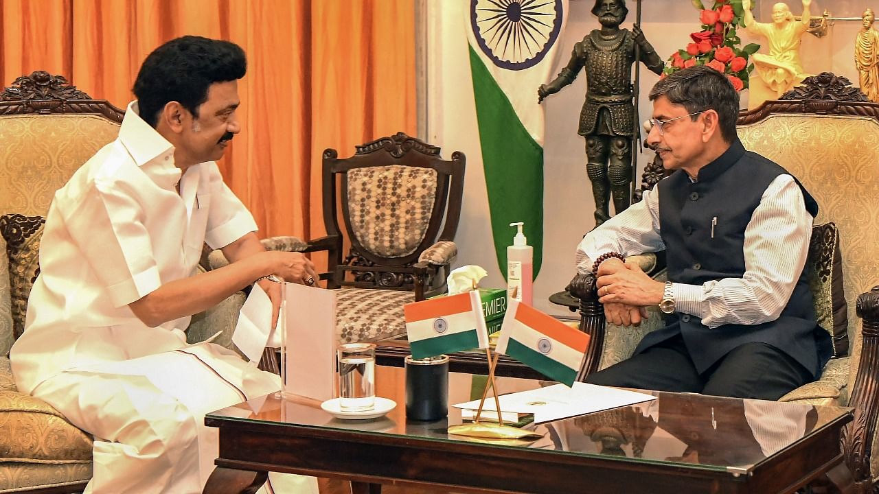 Tamil Nadu Chief Minister MK Stalin interacts with Governor R.N. Ravi. Credit: PTI Photo