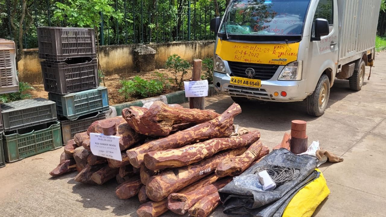 Forest officials seized red sanders logs and the vehicle used to smuggle it from the outskirts of Bengaluru in the early hours of Wednesday. Credit: Karnataka Forest Dept 