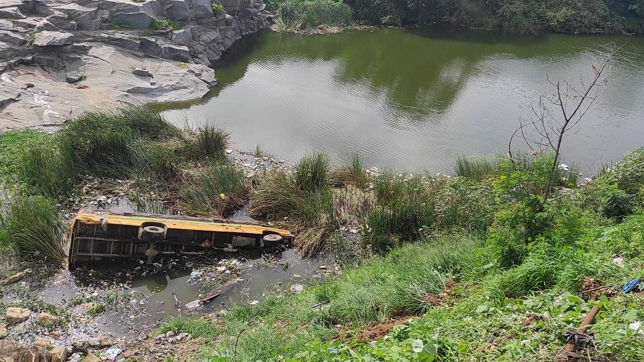 A private school bus fell in to the stone quarry. Credit: DH Photo