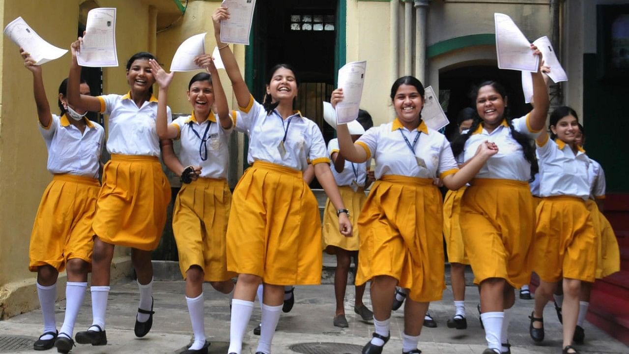 Students celebrate after WBBSE (West Bengal Board of Secondary Education) class 10th examination results were declared, at a school in Kolkata. Credit: PTI Photo