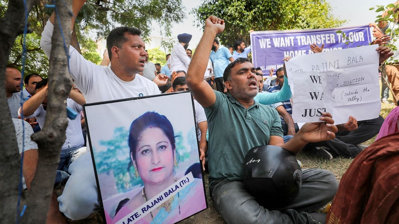 Jammu-based government employees, posted in Kashmir, stage a protest demonstration for their transfer to their home districts, in Jammu. Credit: PTI Photo