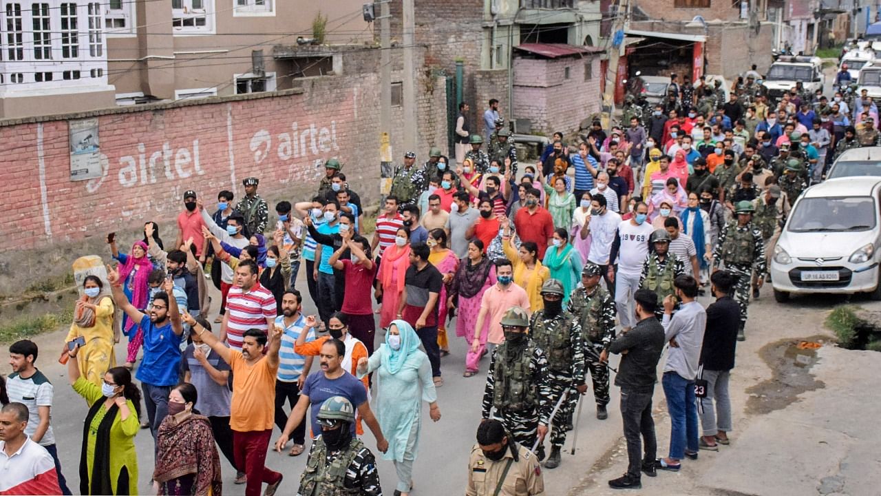 People from the Kashmiri Pandit community shout slogans during their protest march against the killing of the school teacher Rajni Bala. Credit: PTI Photo