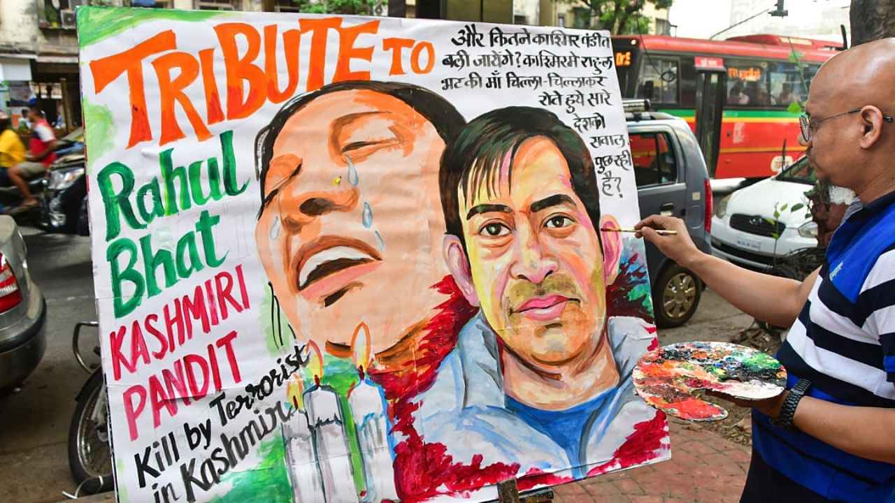  A student from Gurukul art school makes a painting to pay tribute to Rahul Bhat, a Kashmiri pandit killed by militants in Kashmir, in Mumbai, Friday, May 13, 2022. Credit: PTI Photo