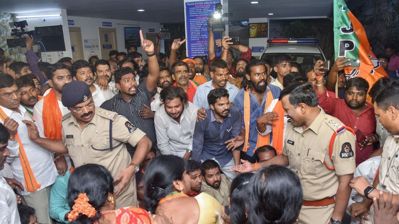 BJP workers protest inside the Jubilee Hills police station demanding justice to a teenager, who was allegedly gang-raped by schoolboys, in Hyderabad. Credit: PTI Photo