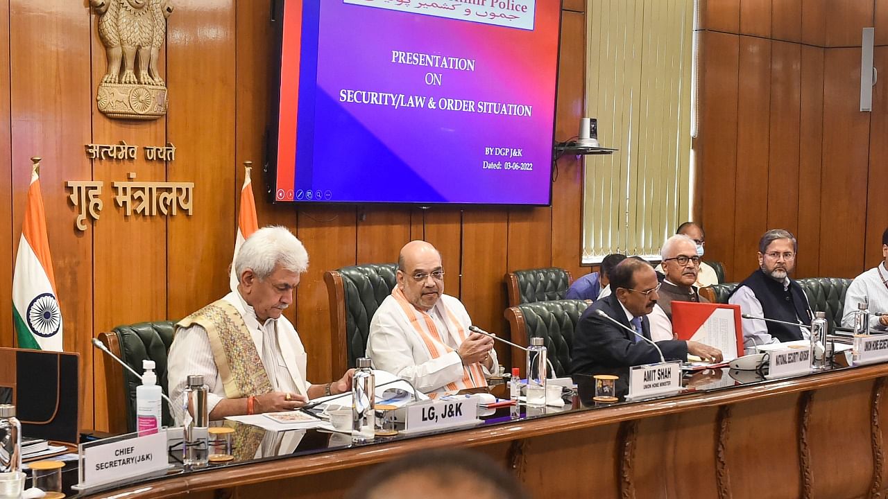 Union Home Minister Amit Shah with J & K Lt Governor Manoj Sinha and NSA Ajit Doval holds a review meeting on security/law & order situation in Jammu and Kashmir. Credit: PTI Photo