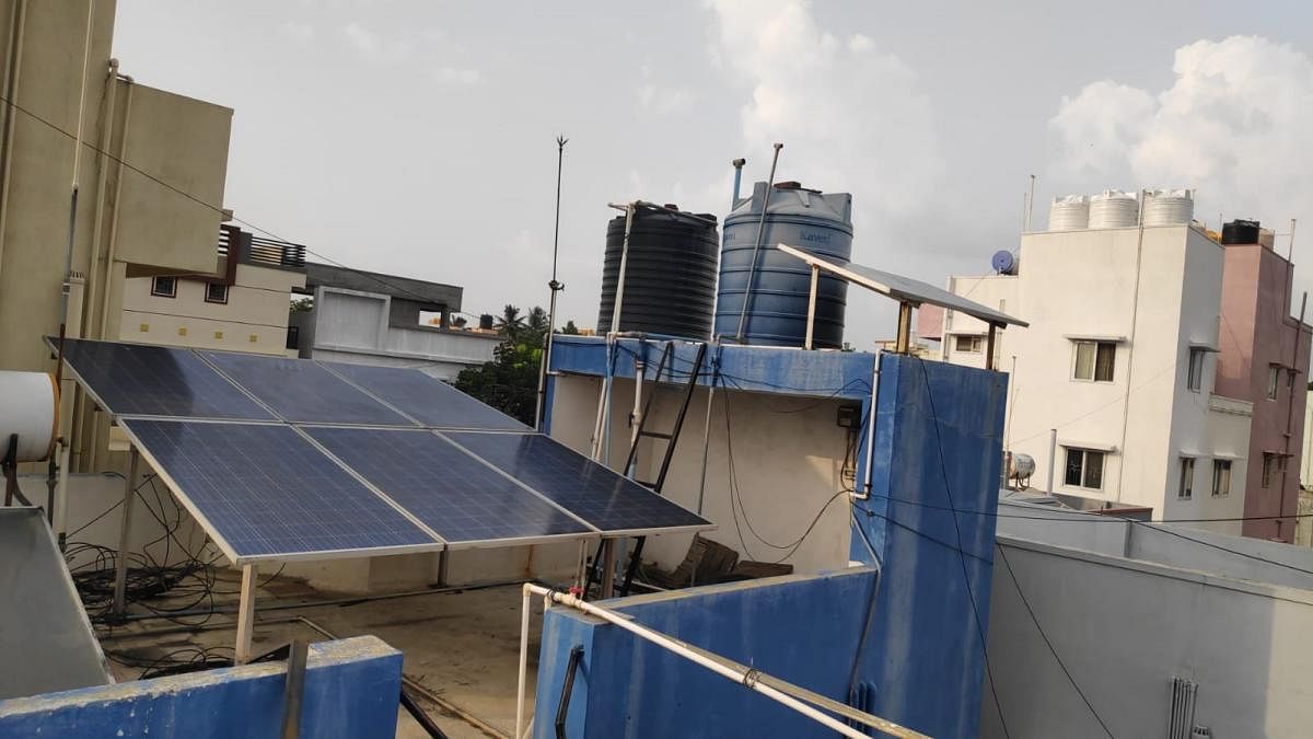 Sivaraman Hariharan, a resident of Kasturinagar, has been utilising solar energy to power his house for nearly four years now. Credit: DH Photo
