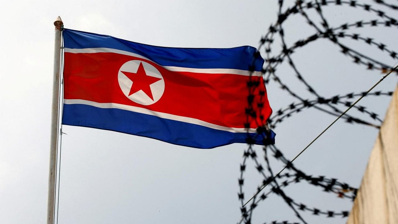 A North Korea flag flutters next to concertina wire at the North Korean embassy in Kuala Lumpur. Credit: Reuters File Photo