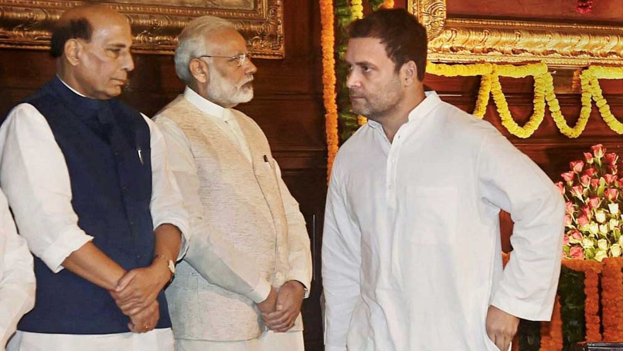 BJP leaders Rajnath Singh, Narendra Modi and Congress leader Rahul Gandhi. Credit: PTI Photo