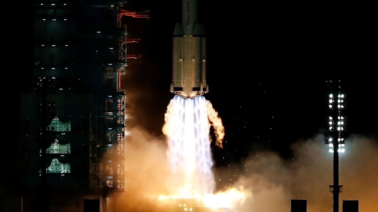 The Long March-2F Y13 rocket, carrying the Shenzhou-13 spacecraft and three astronauts in China's second crewed mission to build its own space station, launches at Jiuquan Satellite Launch Center near Jiuquan, Gansu province, China October 16, 2021. Credit: Reuters File Photo