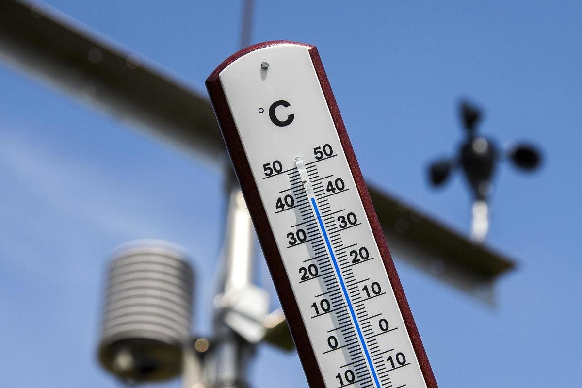 This picture taken on July 25, 2019 shows a thermometer indicating a temperature of over 40 degrees at a Royal Netherlands Meteorological Institute (KNMI) weather station at the Deelen Air Base in Arnhem, the Netherlands. Credit: AFP Photo