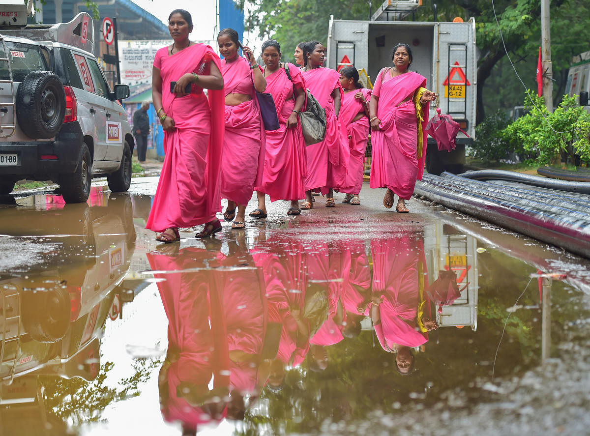 Bengaluru: ASHA workers arrive for a protest rally for resolution of the RCH portal issue, in regards to their wages and deployment for non department works, permanent jobs, at Freedom Park in Bengaluru, Tuesday, May 17, 2022. Credit: PTI Photo