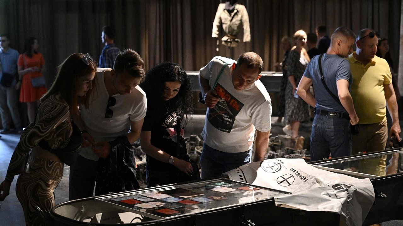 People visit the exhibition on the ongoing war "Ukraine – Crucifixion" at the National Museum of the History of Ukraine in the Second World War, in Kyiv. Credit: AFP Photo