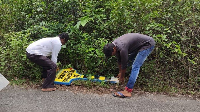 The name board is being cleared at Bola Gram Panchayat limits in Karkala taluk. Credit: Special Arrangement