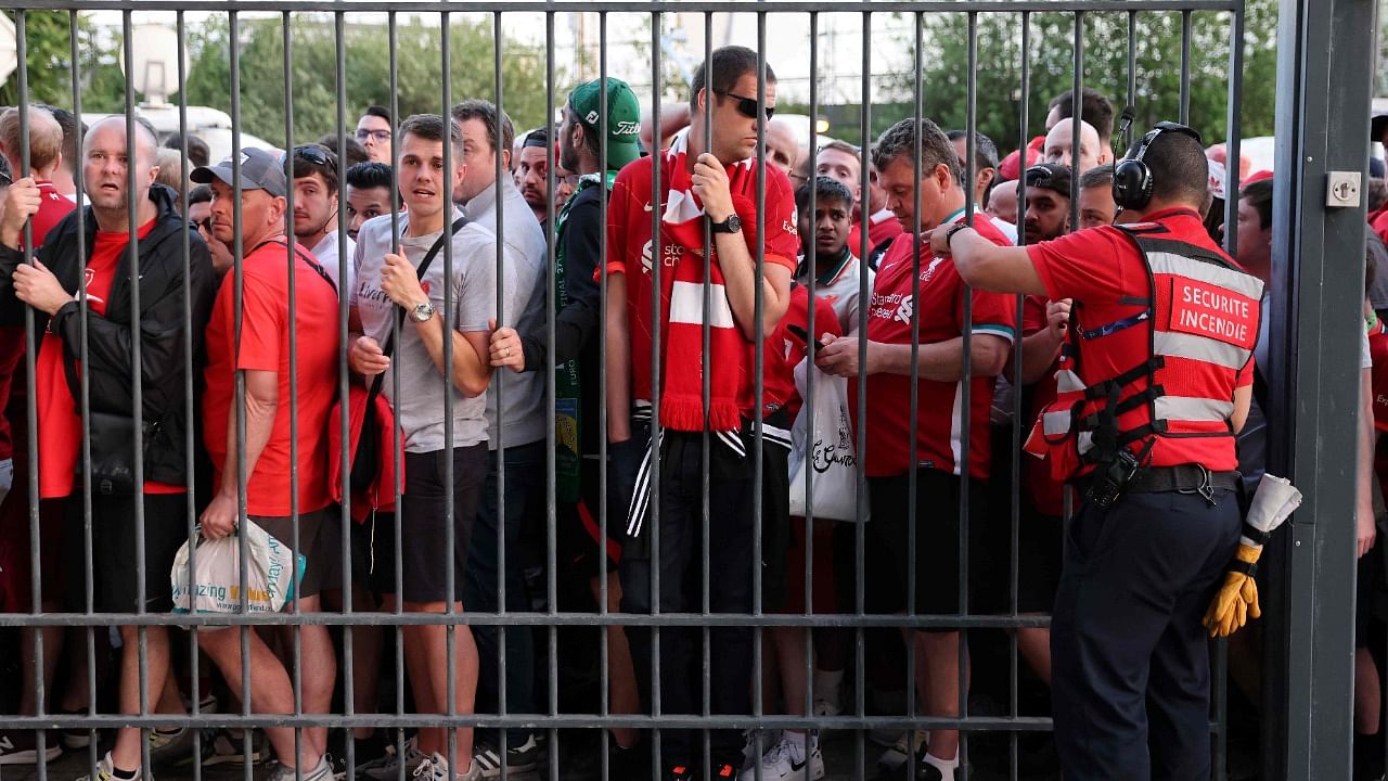 Liverpool fans stand outside unable to get in in time leading to the match being delayed prior to the UEFA Champions League final. Credit: AFP Photo